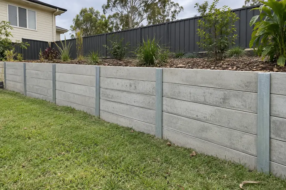 Example concrete sleeper wall in a Queensland-style suburban garden